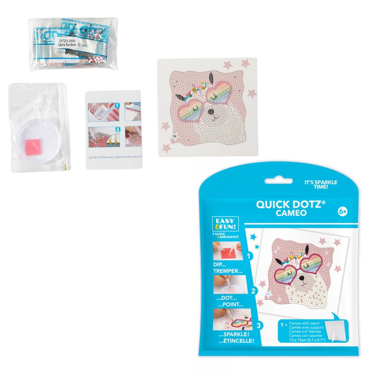Contents of the DIAMOND DOTZ Quick DOTZ Rainbow Llama kit, including the canvas board, blue retail packaging, colorful diamond drills, and crafting tools.