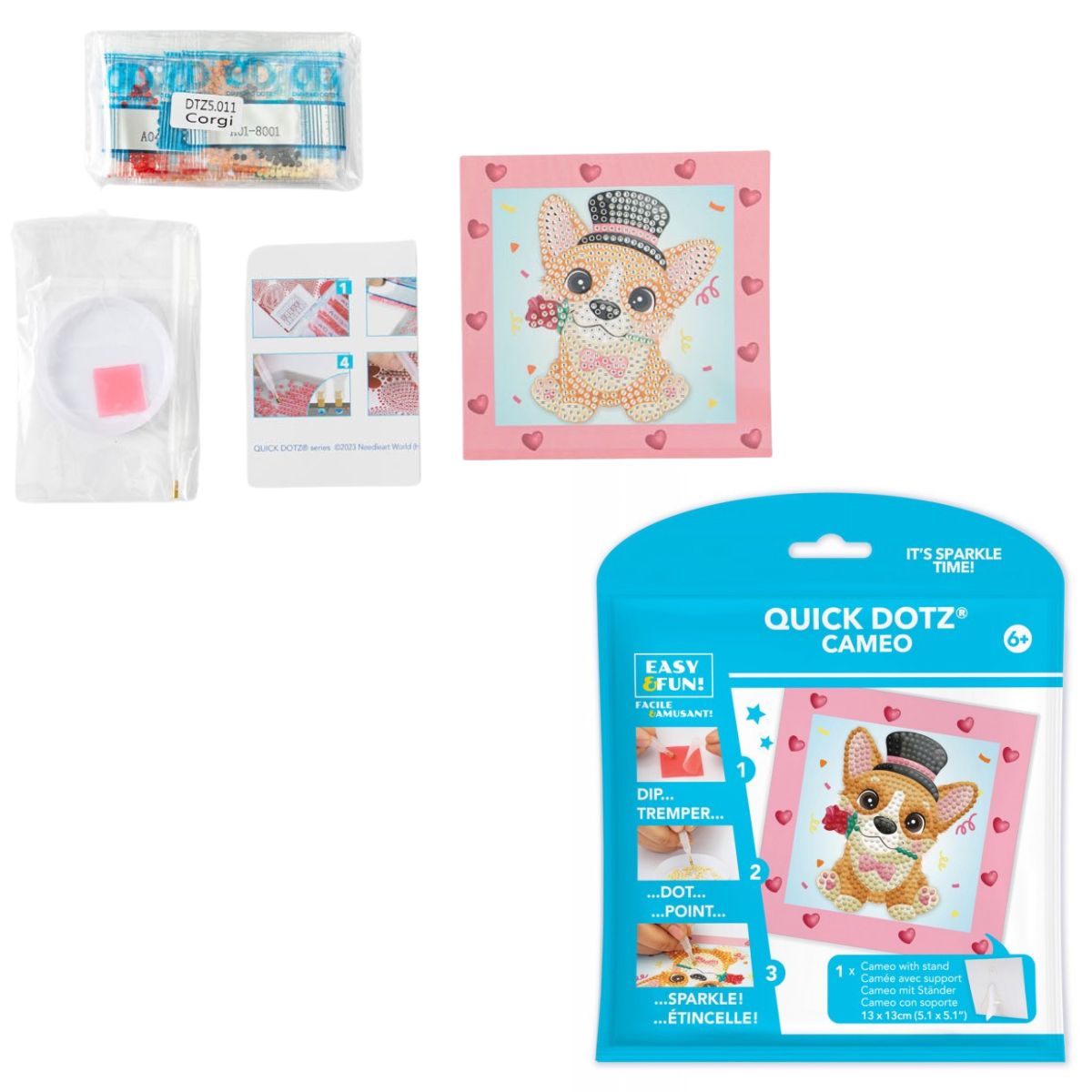 Contents of the DIAMOND DOTZ Quick DOTZ Corgi Top Hat kit, including the canvas board, blue retail packaging, colorful diamond drills, and crafting tools.