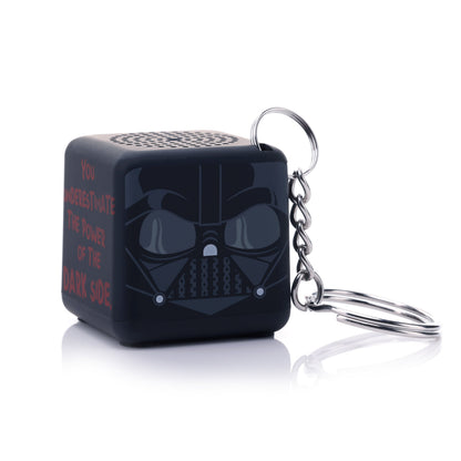Angled front-right view of the cube-shaped Darth Vader mini speaker highlighting the attached silver metal keychain ring.