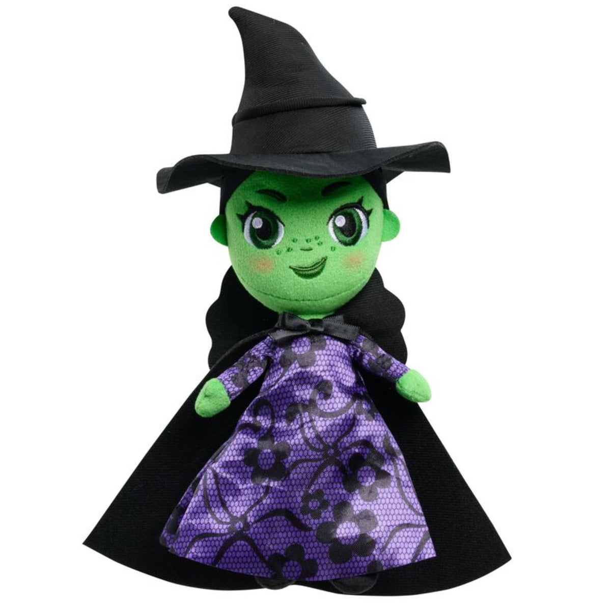 Plush toy of a witch with green face, black hat, and purple dress on a white background
