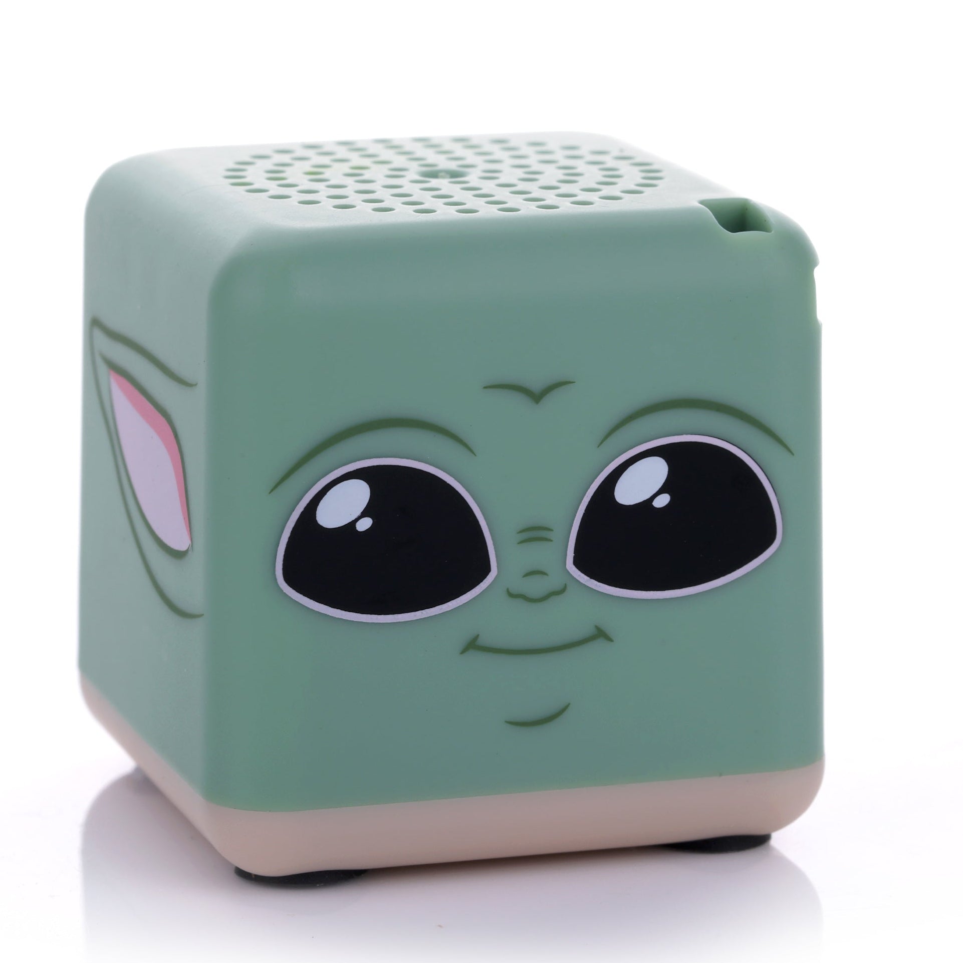Front view of the green cube-shaped Bitty Boomers Star Wars Grogu Bitty Box mini Bluetooth speaker featuring his large black eyes and small smile.