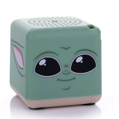 Front view of the green cube-shaped Bitty Boomers Star Wars Grogu Bitty Box mini Bluetooth speaker featuring his large black eyes and small smile.