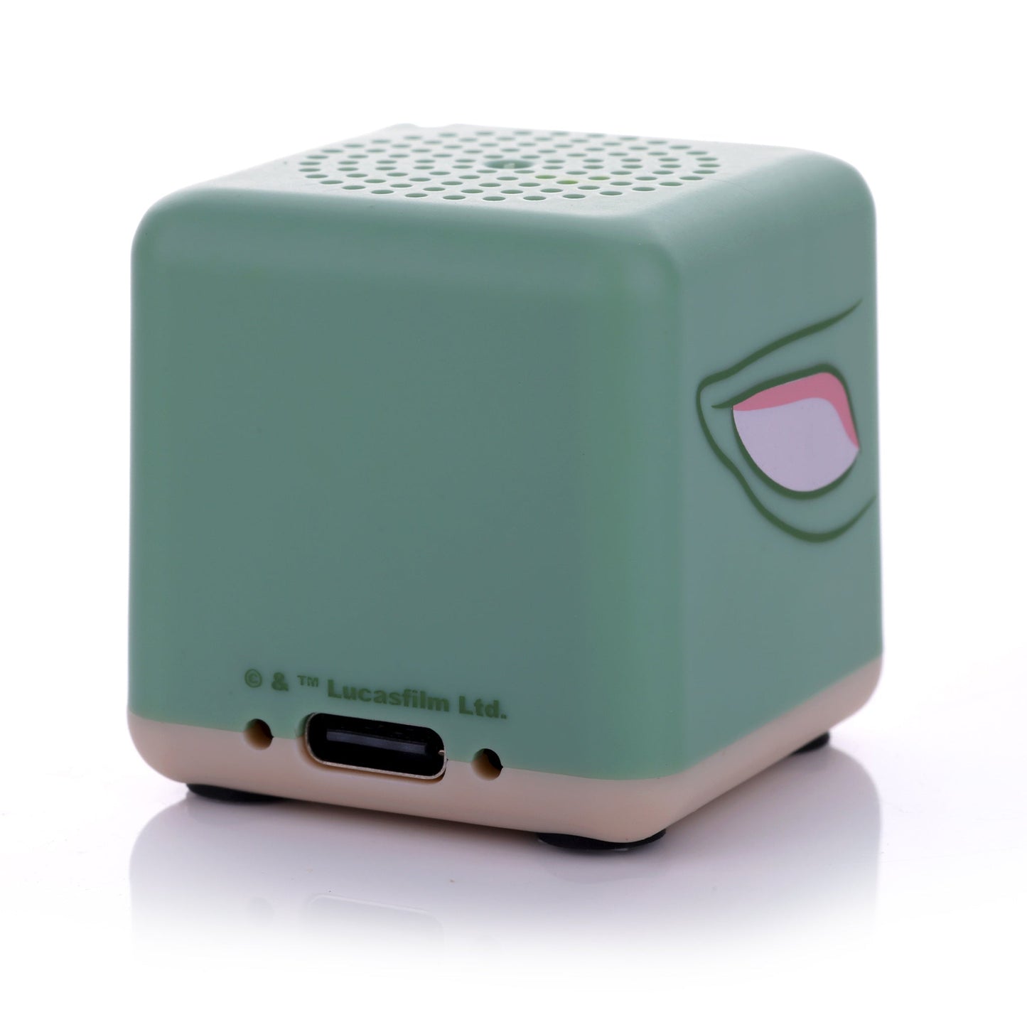 Angled back view of the Grogu Bitty Box speaker showing the smooth green surface and lower charging port.