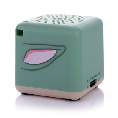 Angled back-right view of the cube-shaped Grogu Bluetooth speaker showing his right ear.