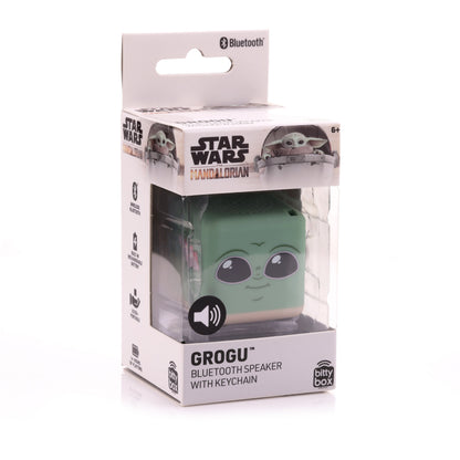 Front view of the Grogu Bitty Box mini Bluetooth speaker inside its official Star Wars The Mandalorian clear display packaging.