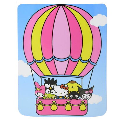Full flat view of the Sanrio Hello Kitty and Friends blanket featuring the characters riding in a pink and yellow hot air balloon against a blue sky.