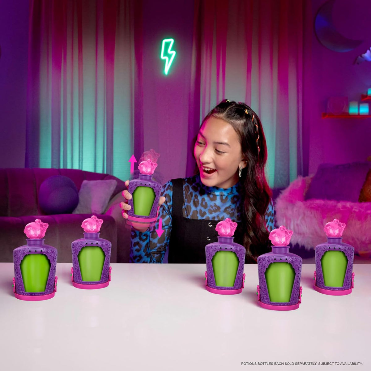 Person holding a potion bottle with green liquid in a room with purple and pink decor.