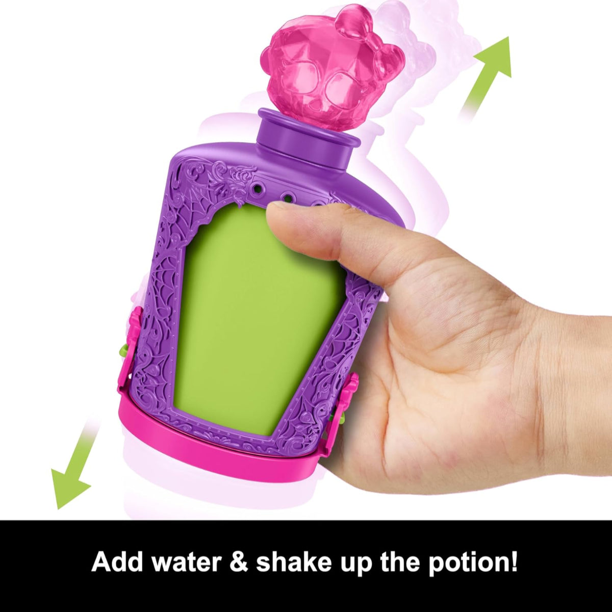 Purple and green toy bottle with pink top, showing a hand dropping a charm into it.