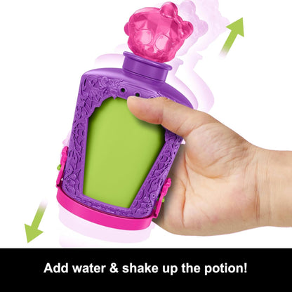 Purple and green toy bottle with pink top, showing a hand dropping a charm into it.