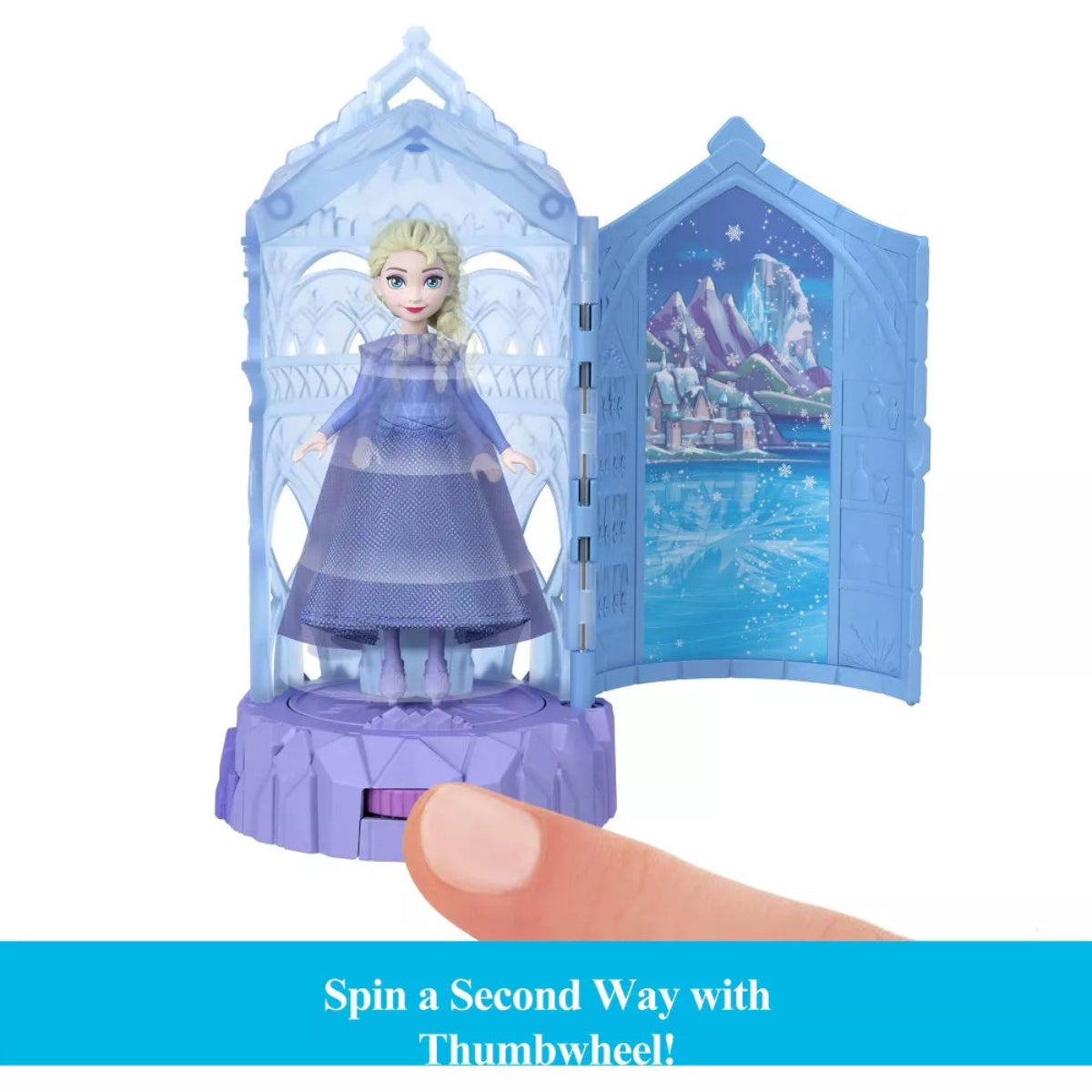 Toy figure of a character in a blue dress with a transparent ice palace background, held by a thumb.