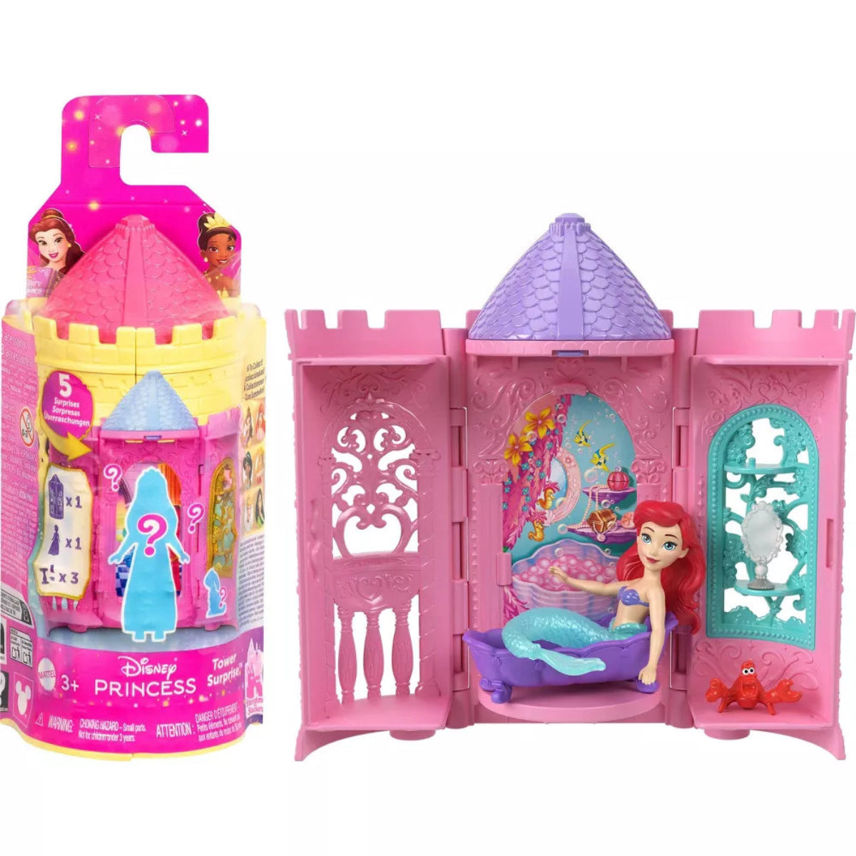 Pink toy castle with mermaid figure and packaging on a white background