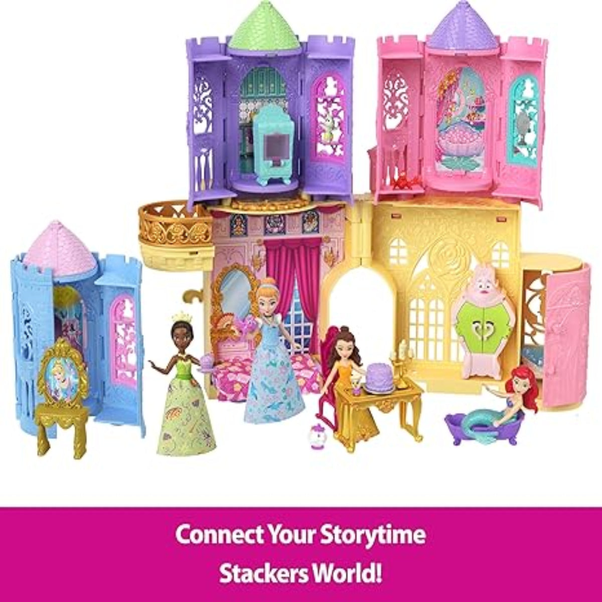 Toy castle set with colorful towers and dolls on a white background