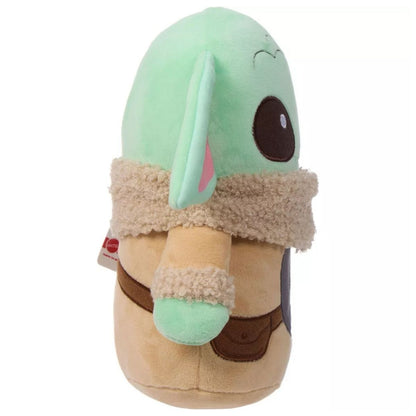 Side view of the Grogu plush showing the depth of the ears and the wrap-around detail of the tan robe and strap.