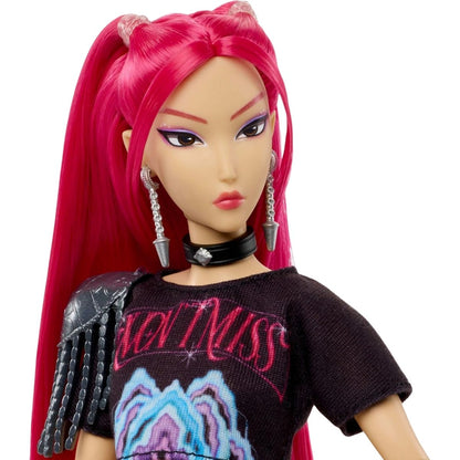 Close-up portrait view thumbnail of the Mira fashion doll highlighting her long magenta hair, dramatic eye makeup, silver drop earring, and black choker collar.