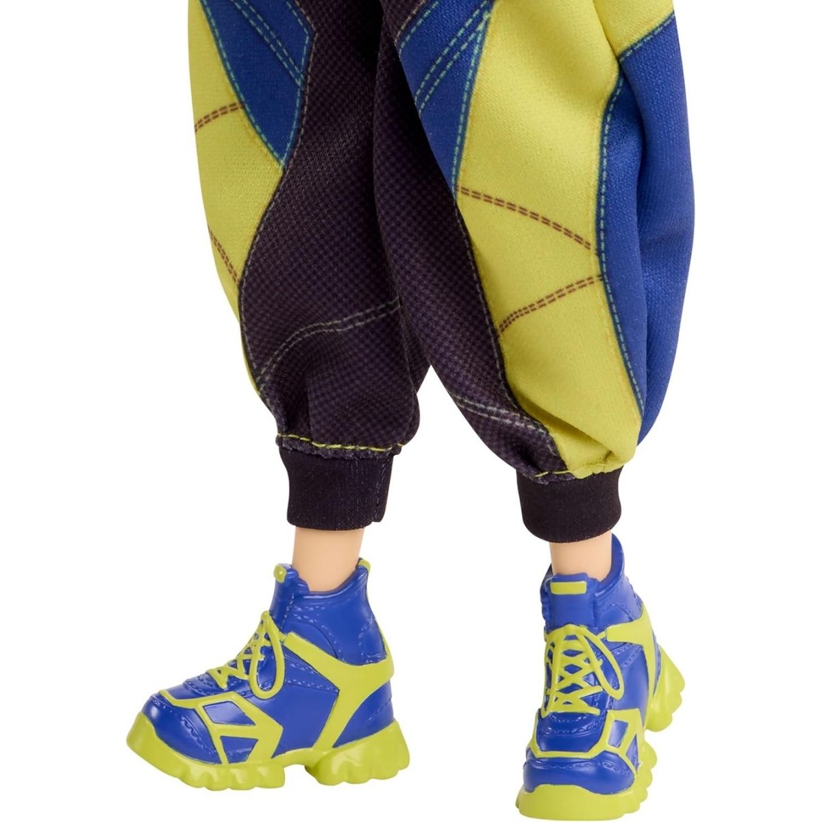 Close-up view of the K-Pop Demon Hunter Zoey doll's chunky blue and neon yellow high-top sneakers and patterned pant cuffs.