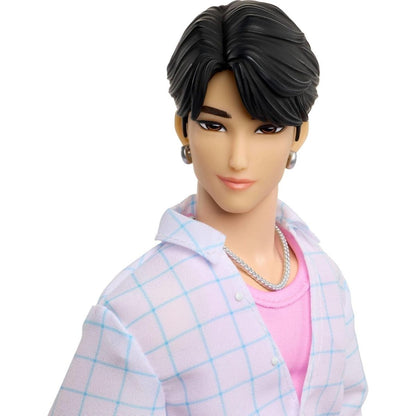 A close-up shot of the 12-inch Jinu fashion doll showcasing detailed sculpted black hair, drop earrings, and a silver necklace.