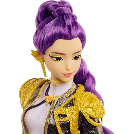 Close-up portrait view thumbnail of the Rumi singing doll featuring her high purple ponytail, dramatic eyeliner, gold drop earring, and gold shoulder armor.