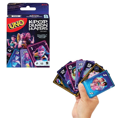 UNO K-Pop Demon Hunters card game box set displayed next to a hand fanning out purple and blue playing cards featuring Rumi, Mira, and Zoey graphics.