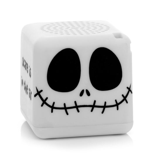 Front view of the white cube-shaped Bitty Boomers Disney Nightmare Before Christmas Jack Skellington Bitty Box mini Bluetooth speaker featuring his stitched smile and dark eye sockets.