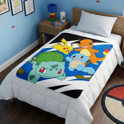 Lifestyle bedroom shot showing the Pokémon characters blanket draped beautifully over a bed.