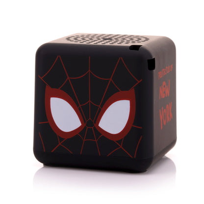 Angled front-right view of the cube-shaped Miles Morales mini speaker highlighting his mask and the top speaker grill.