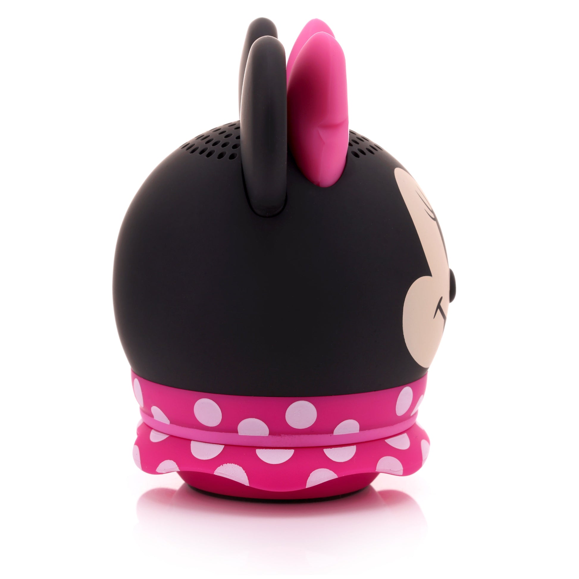 Side profile view of the Minnie Mouse Bluetooth speaker showing the black ear and pink skirt detail.
