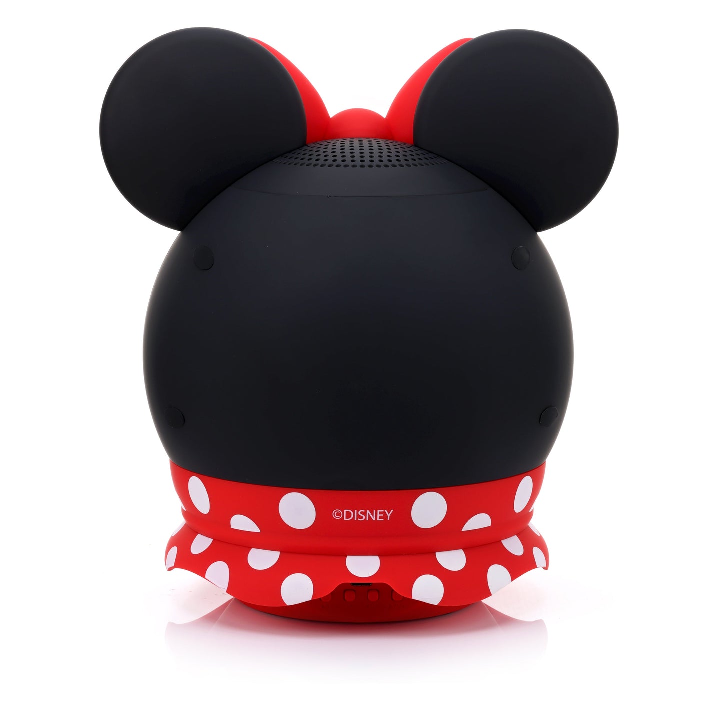 Back view of the Minnie Mouse speaker showing the solid black back, red polka dot skirt, and lower charging port.