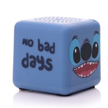 Angled left view of the square Stitch mini speaker showing the phrase 'no bad days' written in black font.
