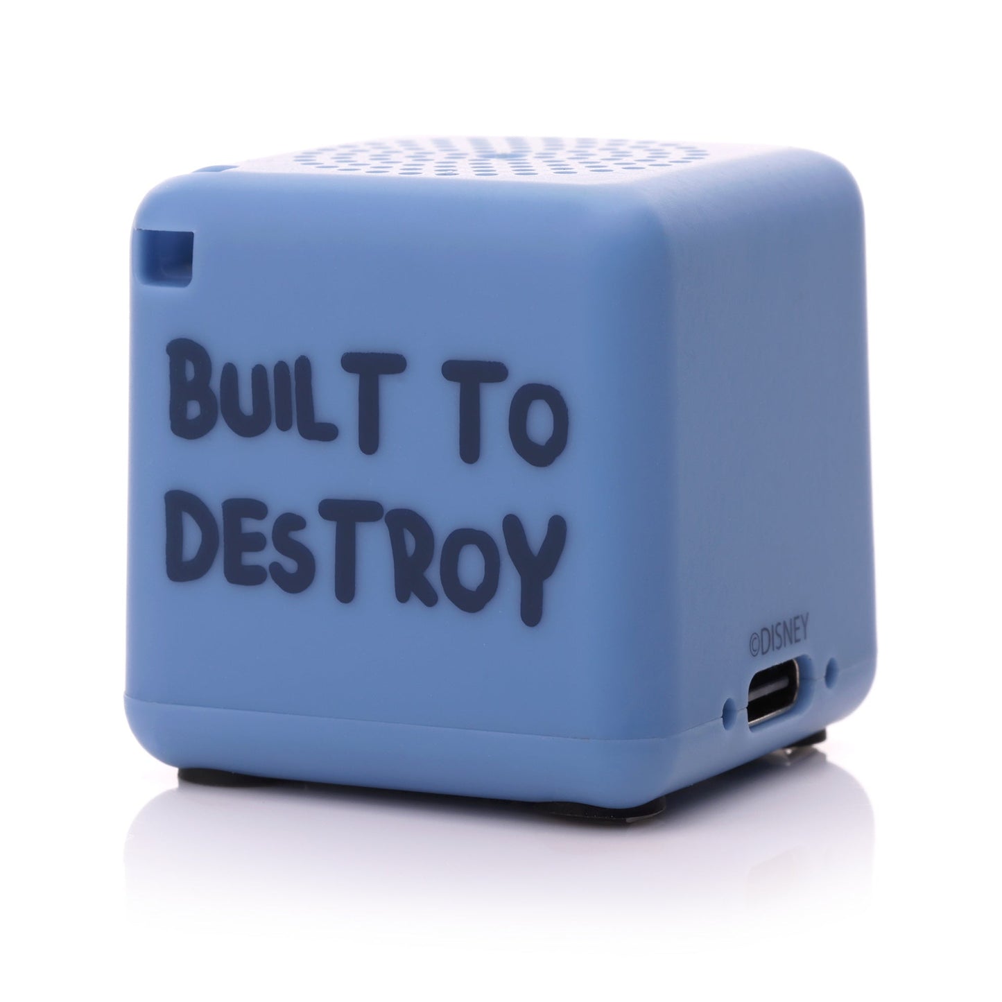 Angled back-right view of the blue Stitch Bluetooth speaker showing the phrase 'BUILT TO DESTROY' written in black font.