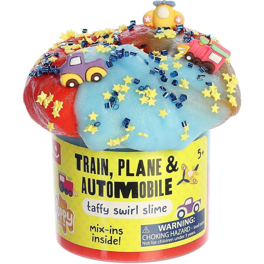 Close-up view of the blue and red swirl slime overflowing from its clear plastic jar, heavily decorated with yellow stars, dark blue beads, and tiny car, plane, and train charms.