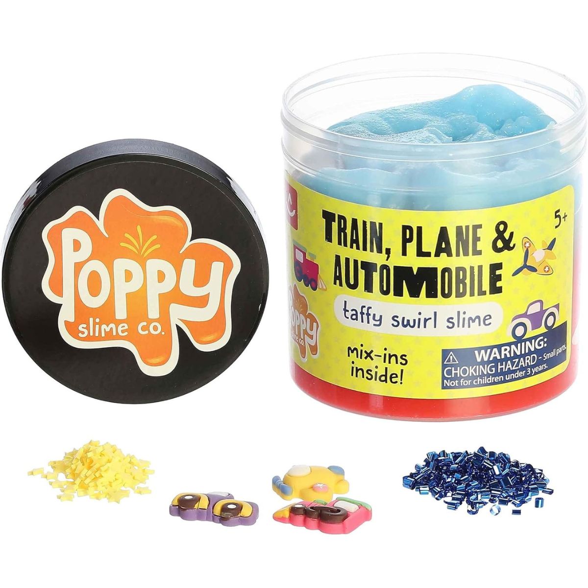 Front view of the Train, Plane & Automobile slime jar next to its black lid featuring the orange Poppy Slime Co. logo, with loose mix-in pieces scattered in front.