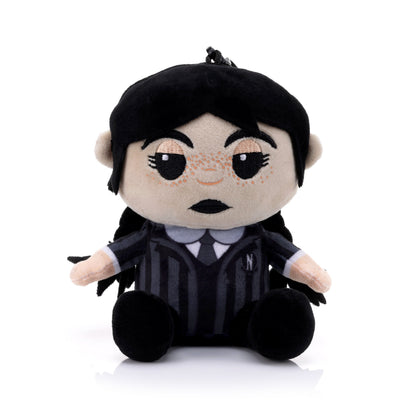 Front view of the Bitty Boomers Wednesday Addams plush Bluetooth speaker featuring her signature braids, freckles, and black and grey striped Nevermore Academy uniform.