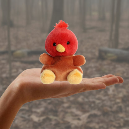 Small red and brown plush toy held in a hand with a measurement label indicating 5 inches.