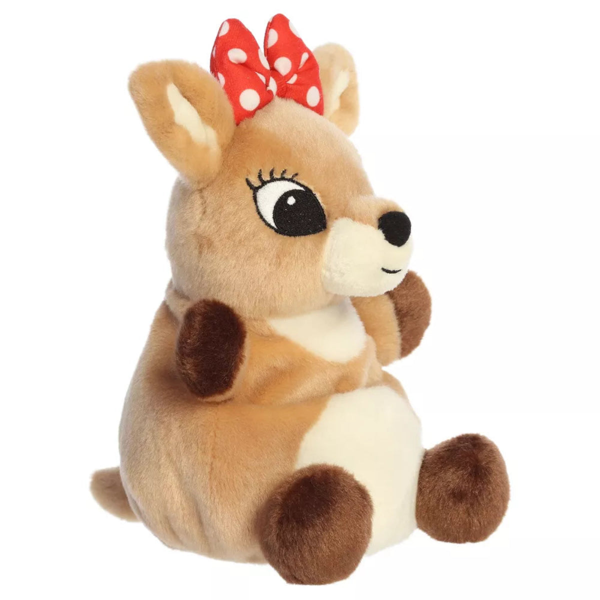 Three-quarter angled seated view of Aurora Clarice 8-inch plush showing cream belly, red bow, and black nose.