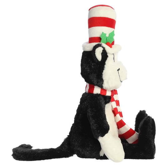 Side profile thumbnail of sitting Cat in the Hat Christmas plush showing striped scarf and long black tail.