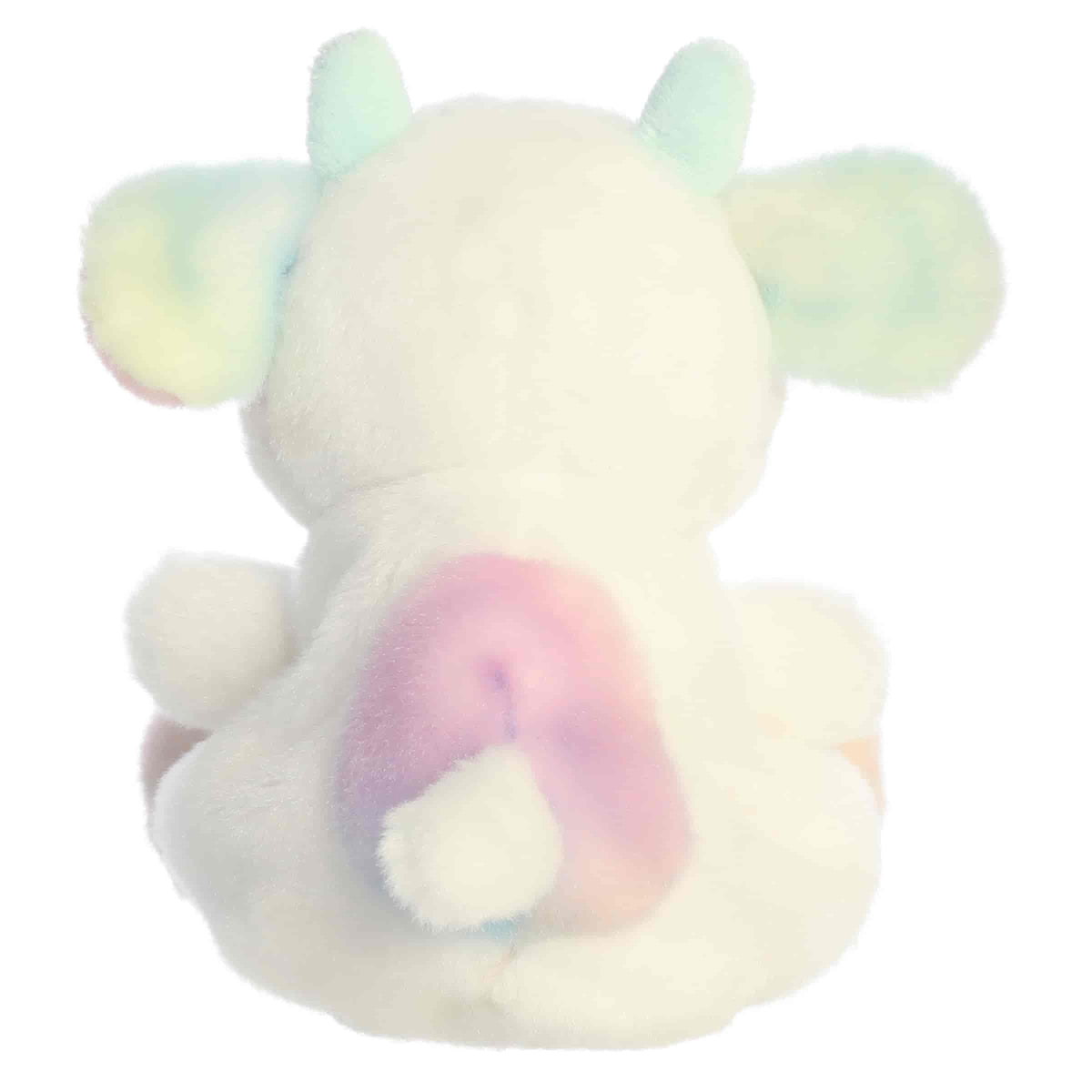 Back view of Aurora Palm Pals Georgia Rainbow Cow plush highlighting white fur, pastel rump spots, and tail.