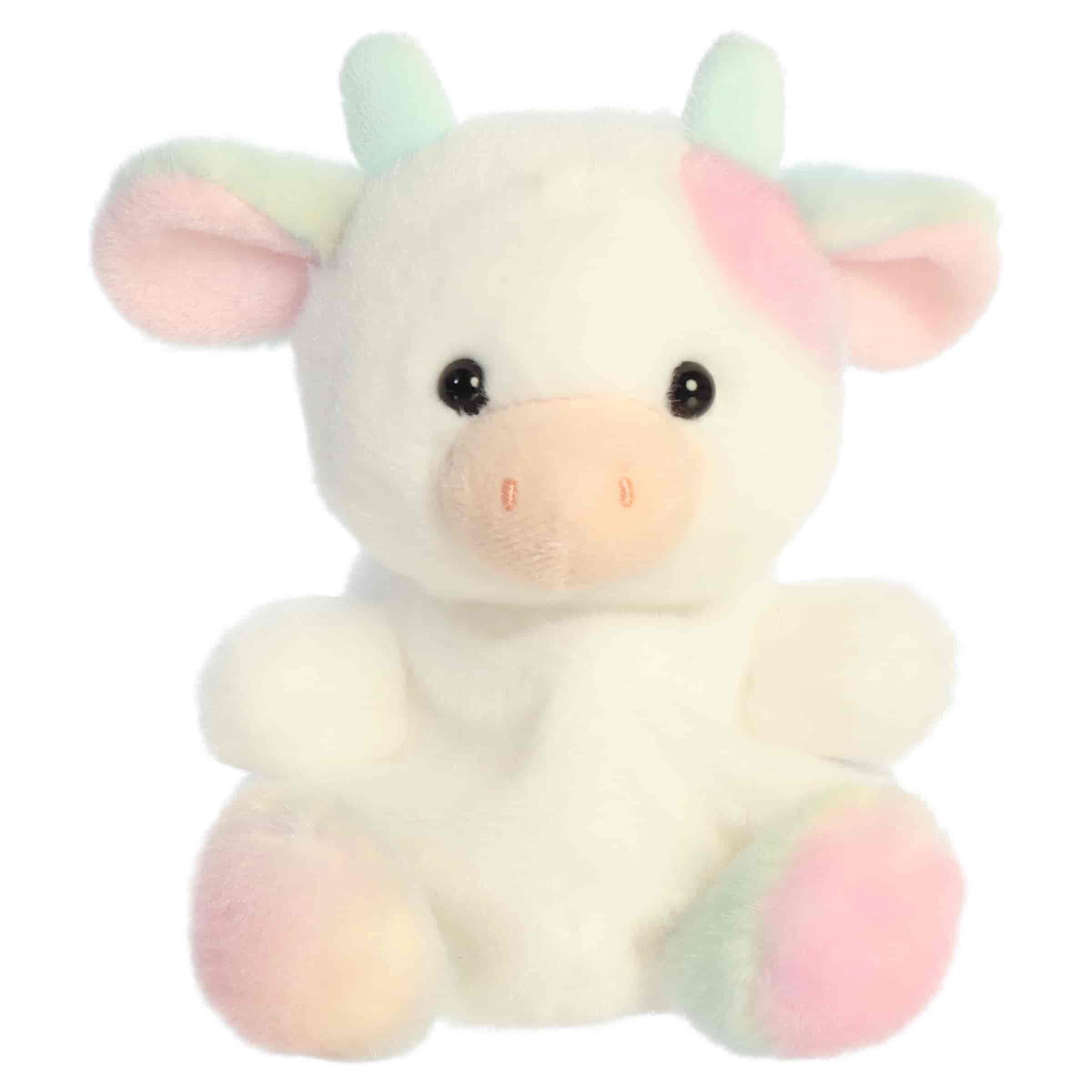 Head-on front seated view of Aurora Palm Pals Georgia Rainbow Cow plush showing pink muzzle, horns, and pastel hooves.