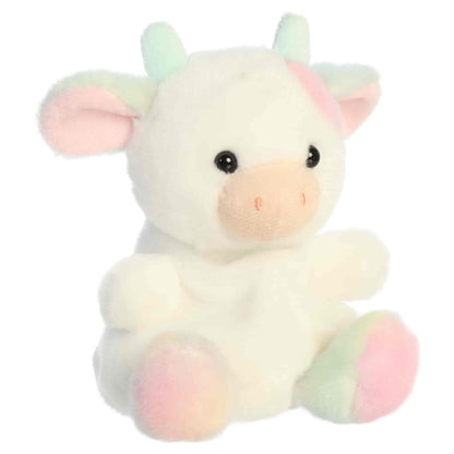 Front three-quarter view of Aurora Palm Pals Georgia Rainbow Cow 5-inch plush with pastel rainbow spots and blush muzzle.