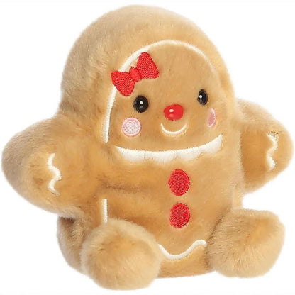 Aurora Palm Pals Gia Gingerbread Girl 5-inch plush stuffed animal toy with red bow and icing details.