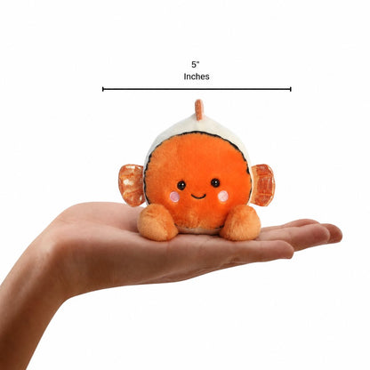 Aurora Palm Pals Giggles Clownfish plush resting in an open palm with 5-inch vertical height scale measurement bar.