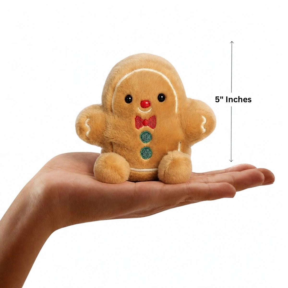 Aurora Palm Pals 5-inch Gio Gingerbread Man plush resting in an open hand with height measurement graphic.