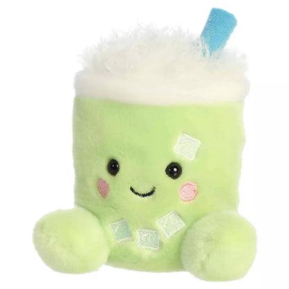 Slight three-quarter angled view of Aurora Palm Pals Jade Iced Matcha Latte plush highlighting embroidered ice cubes and cheerful face.