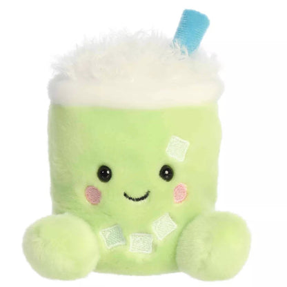Head-on front view of Aurora Palm Pals Jade Iced Matcha Latte plush showing stitched smile, rosy cheeks, and green feet.   