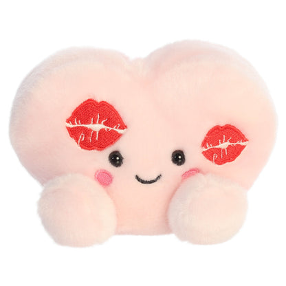 Aurora Palm Pals Kayleigh Kisses Heart 5-inch light pink stuffed animal plush with two embroidered red kiss marks and fluffy pink feet.