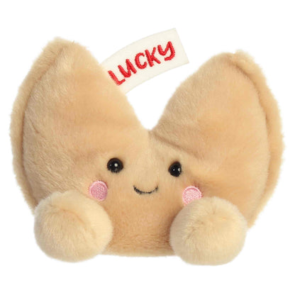 Direct front view of Aurora Palm Pals Lucky Fortune Cookie plush showing smiling face, rosy cheeks, and cream feet.
