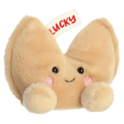 Front three-quarter view of Aurora Palm Pals Lucky Fortune Cookie 5-inch plush with embroidered LUCKY paper slip.