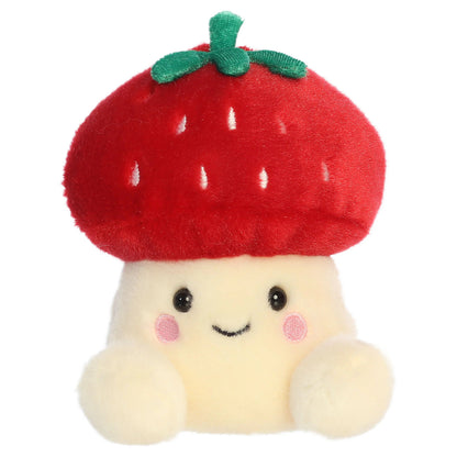 Head-on front view of Aurora Palm Pals Lucy Strawberry Mushroom plush showing stitched smile and rosy cheeks.