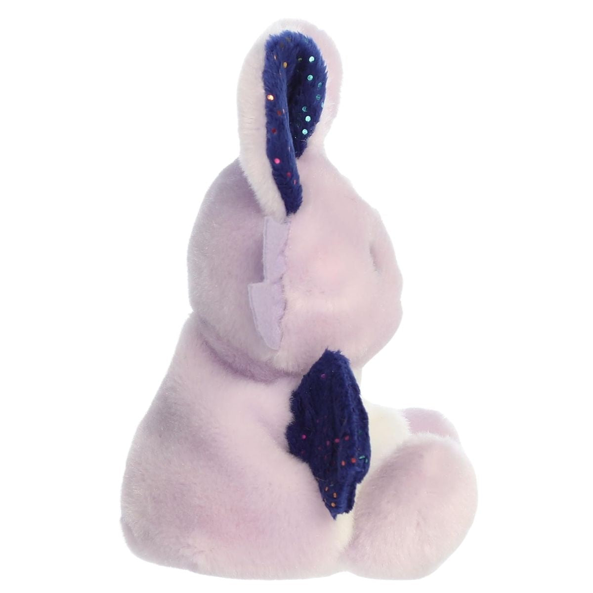 Side profile thumbnail of Nora Night Beast stuffed plush displaying her midnight blue wing and sitting pose.