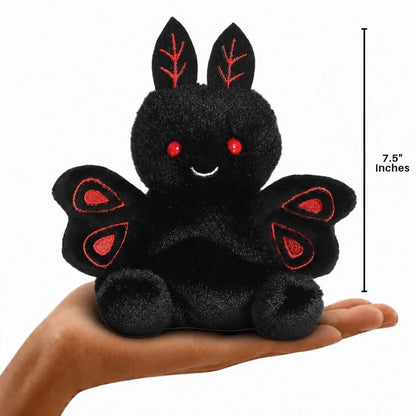 Aurora Palm Pals Mortimer Mothman plush resting in a palm with 7.5-inch height scale measurement graphic.