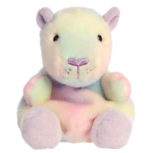 Head-on front seated view of Aurora Palm Pals Seb Sorbet Capybara plush showing heart nose, stitched muzzle, and lilac feet.